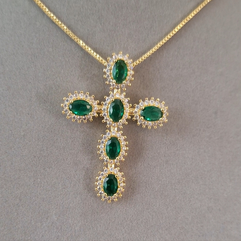 Emerald oval shape cross necklace.